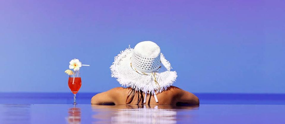 Woman looking out to sea on holiday